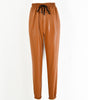 Pantaloni jogger a vita elastica in similpelle da donna  