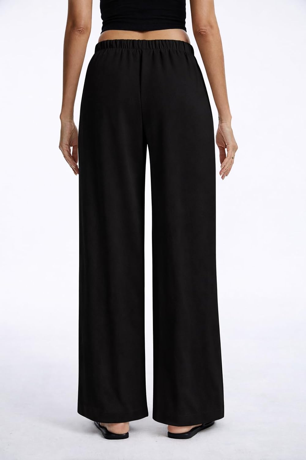 Pantaloni larghi fluidi in crepe per donna