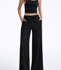 Pantaloni larghi fluidi in crepe per donna