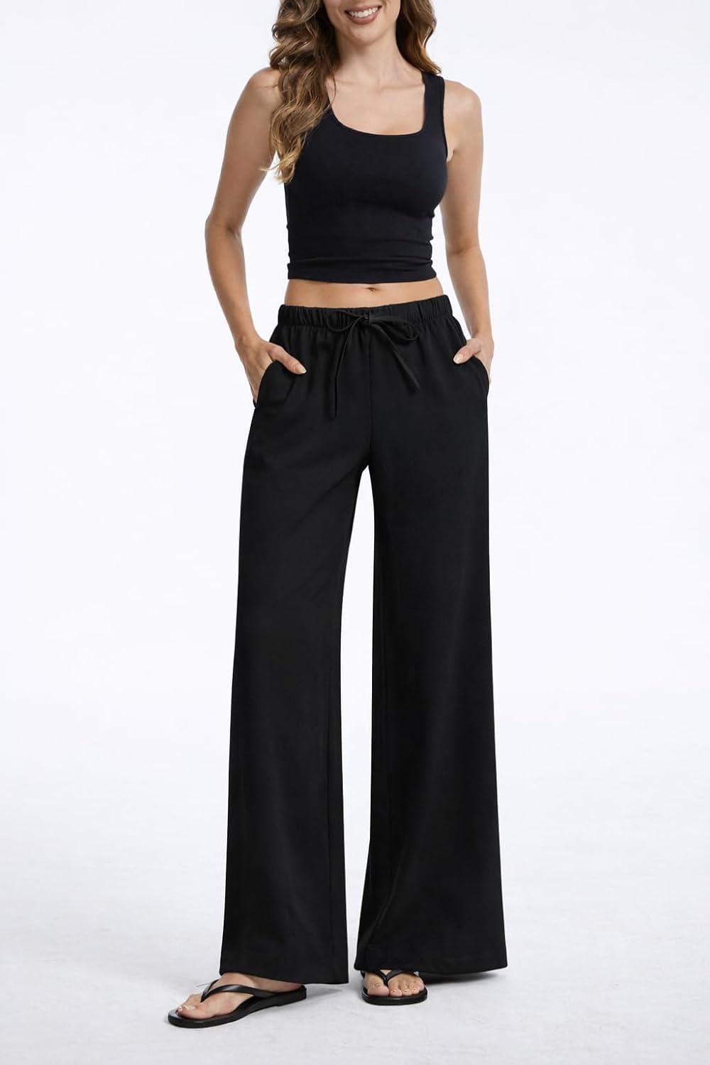 Pantaloni larghi fluidi in crepe per donna