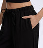 Pantaloni larghi fluidi in crepe per donna