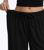 Pantaloni larghi fluidi in crepe per donna