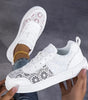 Sneakers in pizzo floreale con lacci da donna