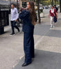 Pantaloni larghi e lunghi in denim con cuciture a vista da donna