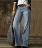 Pantaloni in jeans larghi e slavati a vita media da donna  