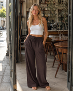 Pantaloni palazzo larghi a vita alta con tasche per donna